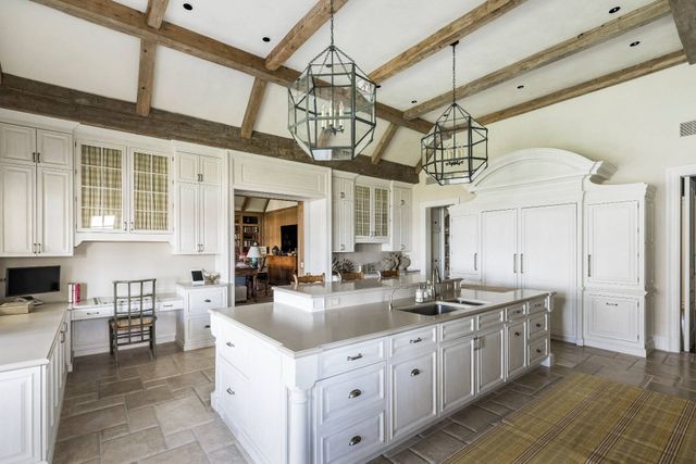 a kitchen with a sink and cabinets
