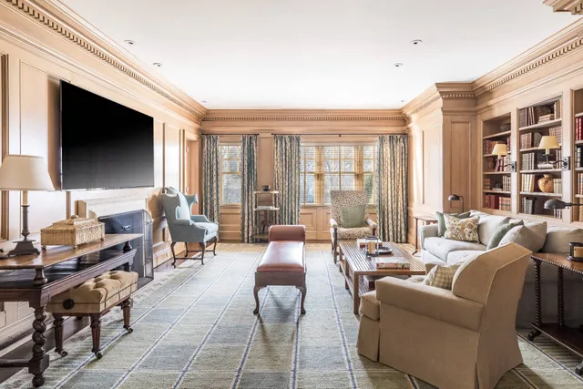 a living room with furniture fireplace and a flat screen tv
