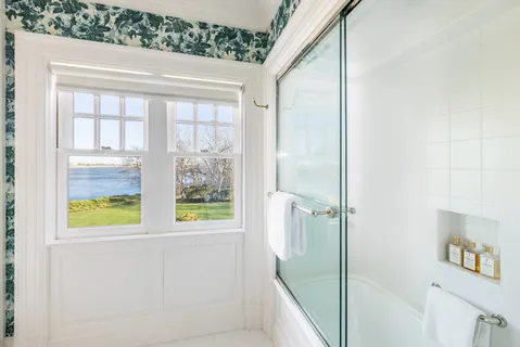 a bathroom with a bathtub and a shower