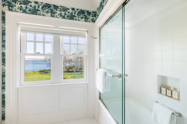 a bathroom with a bathtub and a shower