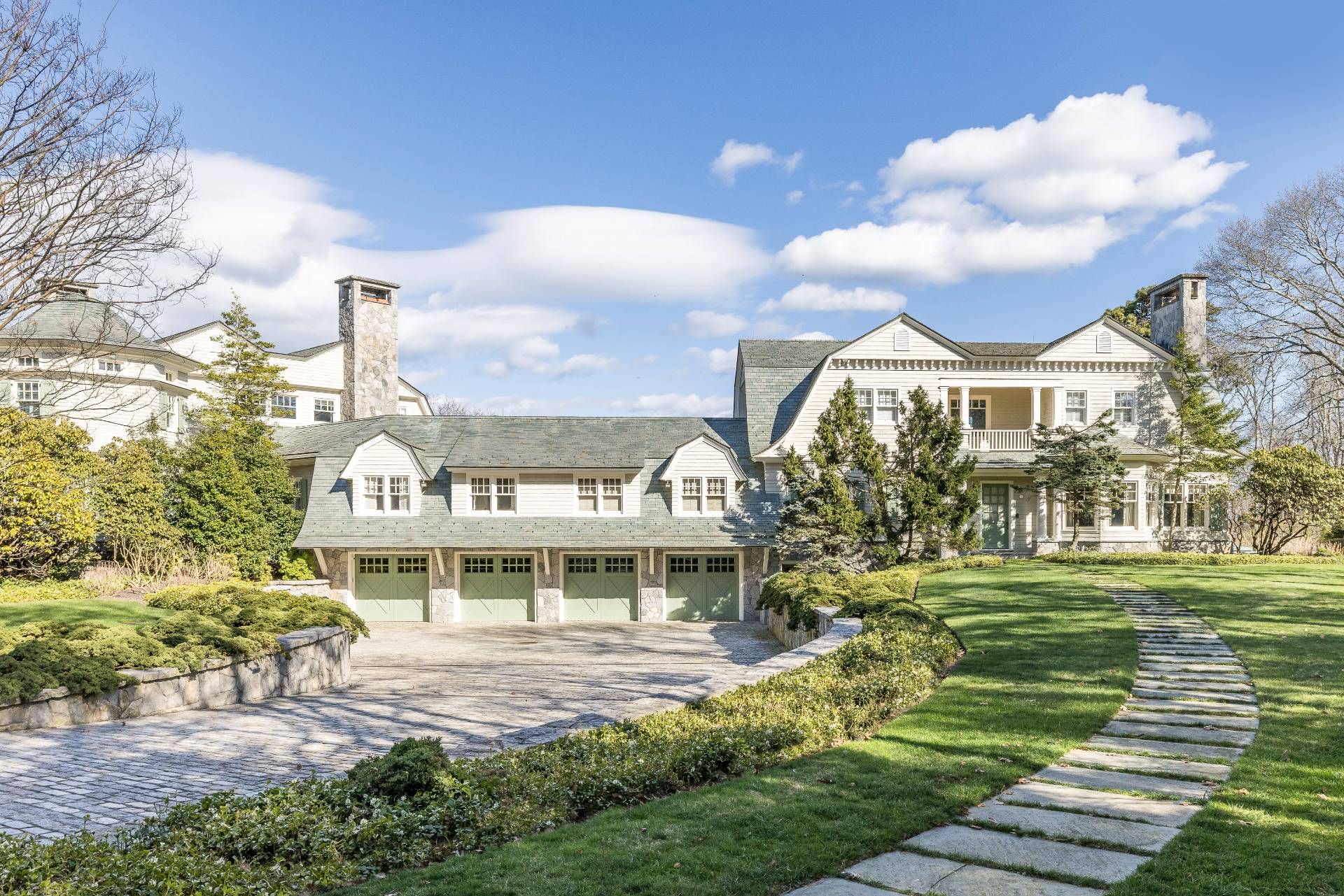 38 Mathews Road Wainscott, NY 11975 - Photo 46 of 48 a front view of a house with a garden