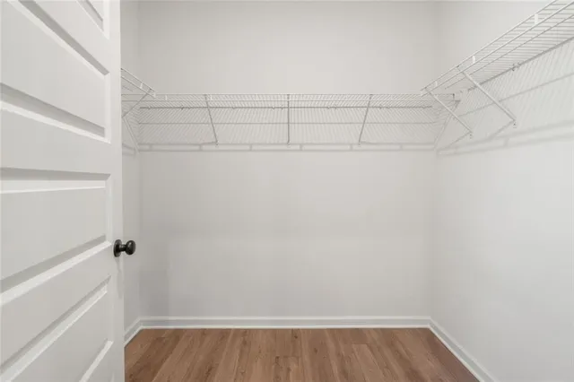 a bathroom with a double vanity sink a mirror and shower