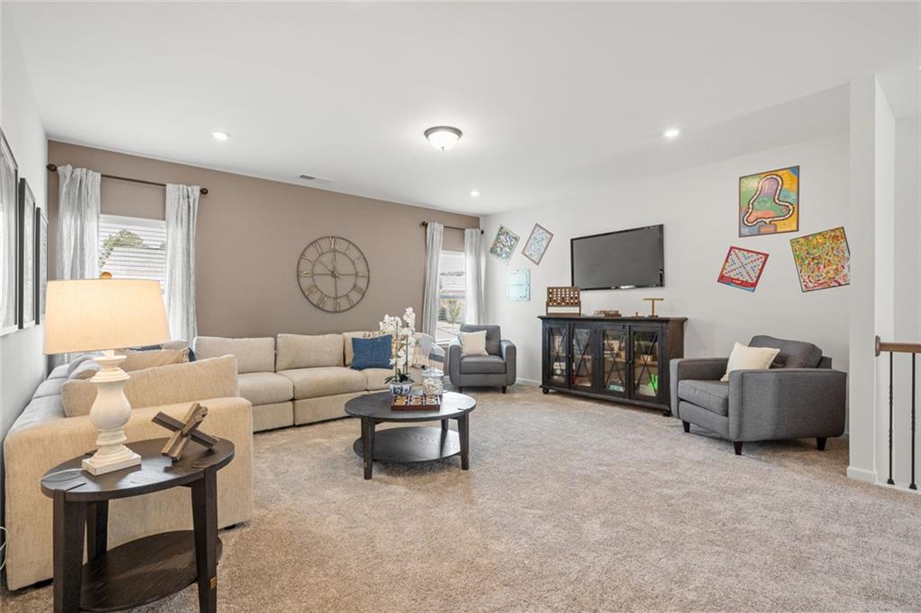 12 North Haven Drive Rome, GA 30161 - Photo 23 of 30 a living room with furniture and a flat screen tv