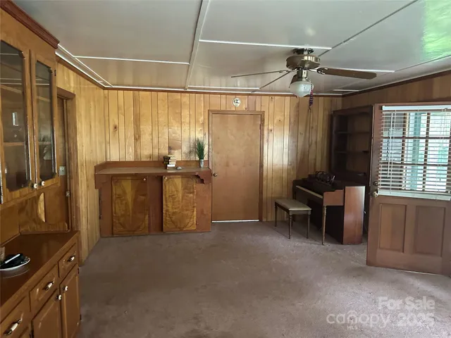 a view of a room with furniture and a window