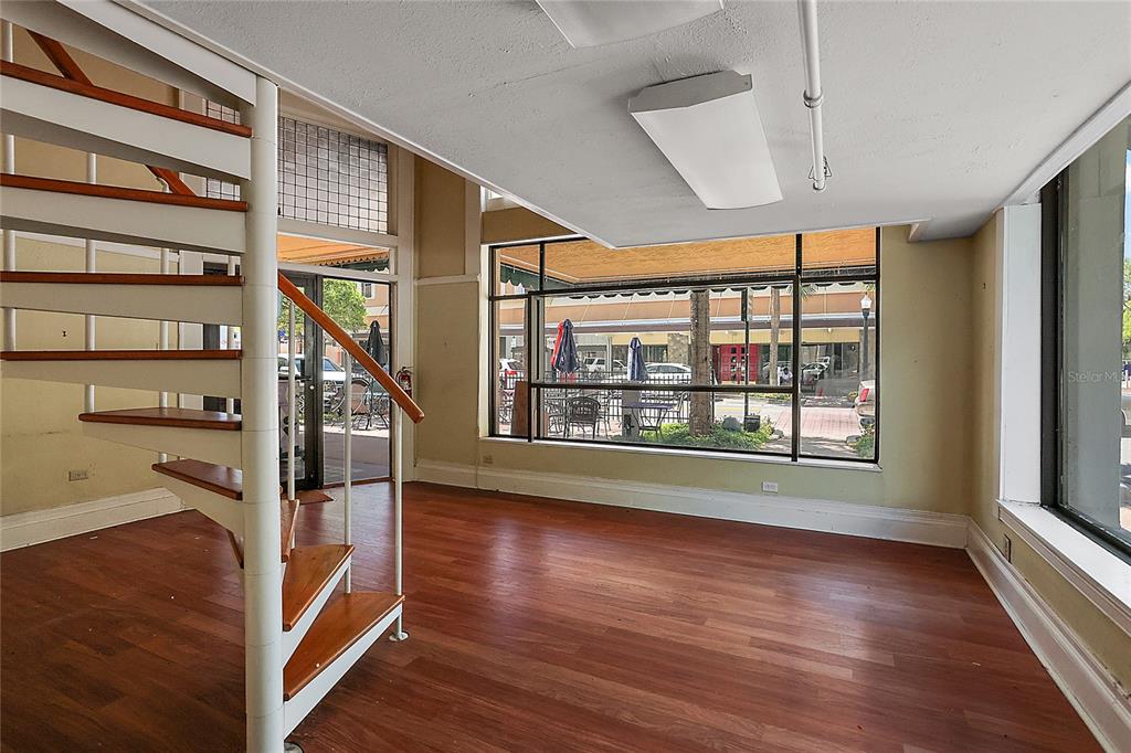 410 West Main Street Leesburg, FL 34748 - Photo 27 of 28 a view of entryway with wooden floor and fence