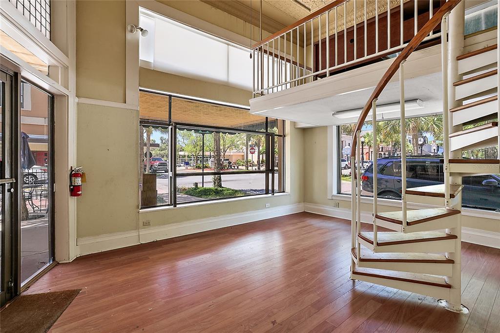 410 West Main Street Leesburg, FL 34748 - Photo 28 of 28 a view of entryway with wooden floor and front door