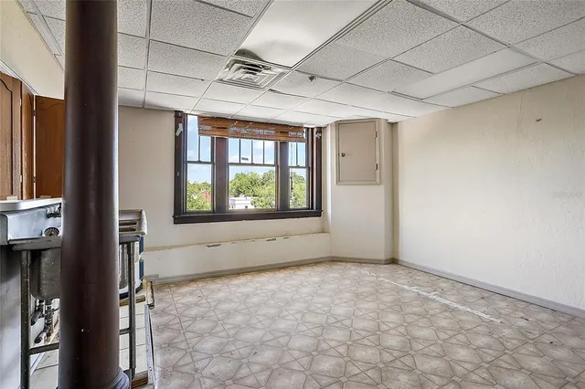 a view of an empty room with a window