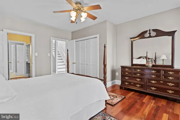 a bedroom with a bed and a dresser