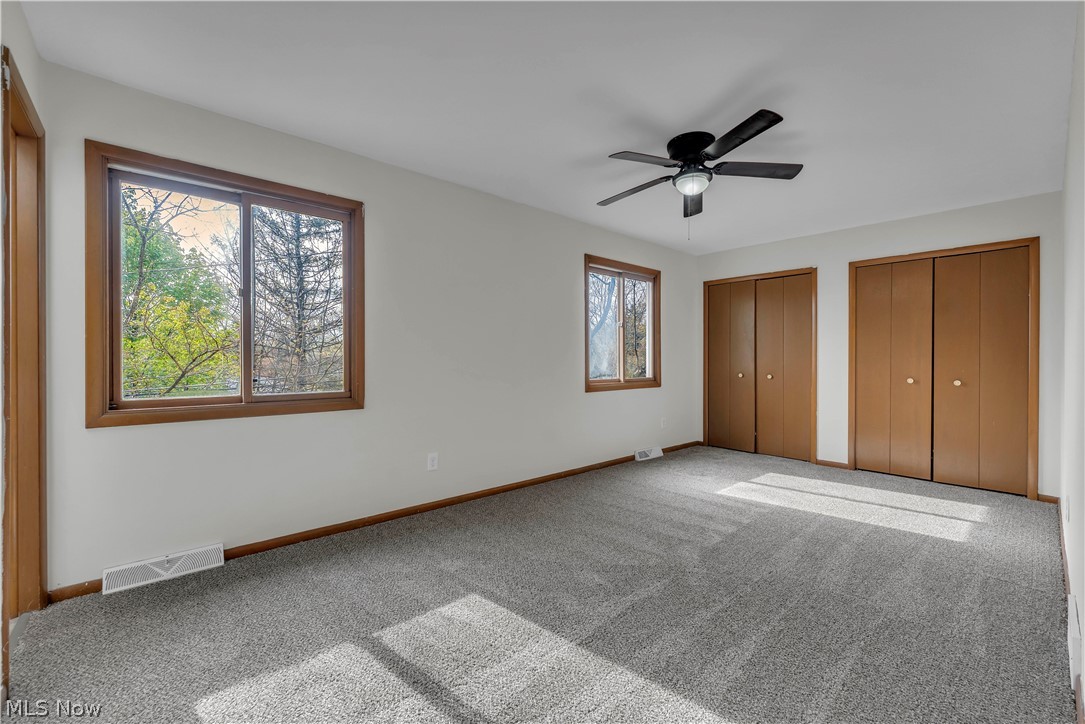 2540 Charney Road University Heights, OH 44118 - Photo 25 of 44 Room with gray carpet flooring, white walls, and wood-framed windows