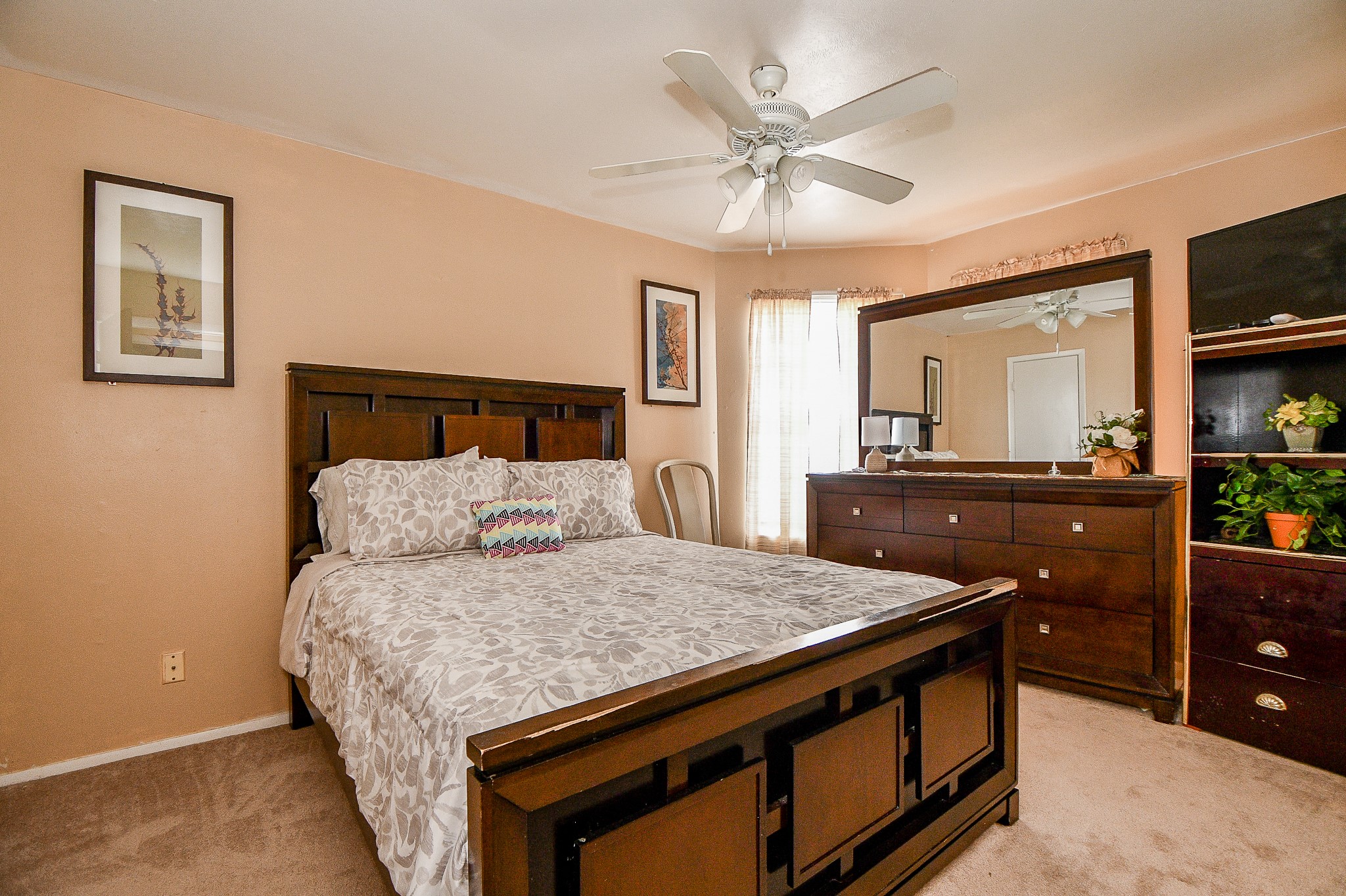 2923 West Greens Road Houston, TX 77067 - Photo 15 of 32 a living room with a bed and furniture