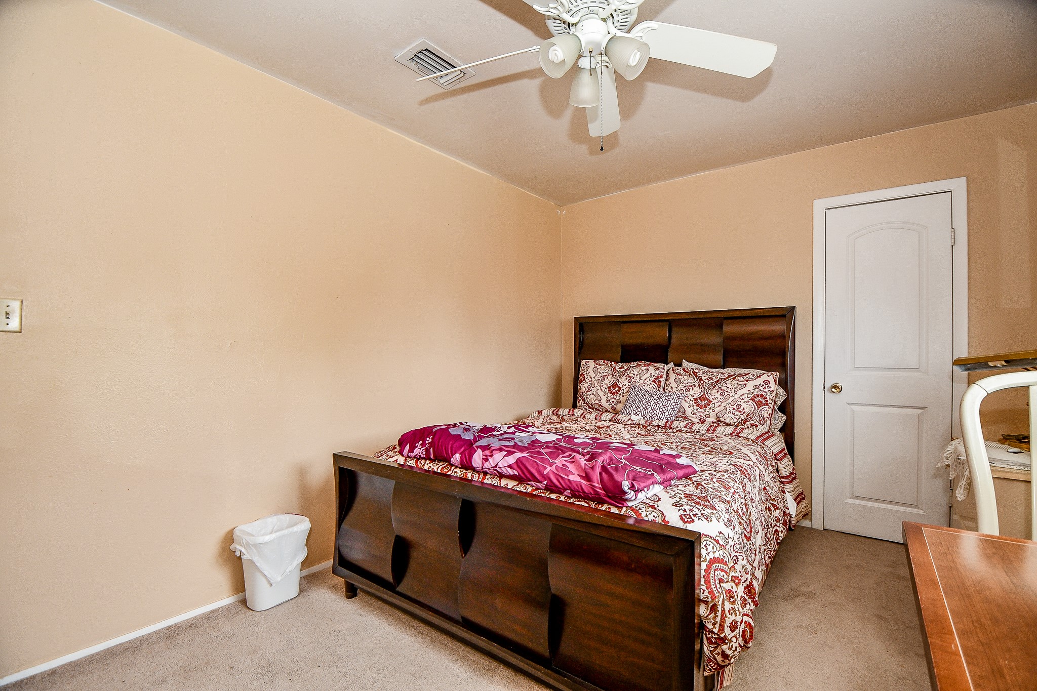 2923 West Greens Road Houston, TX 77067 - Photo 21 of 32 a bedroom with a bed and a chandelier