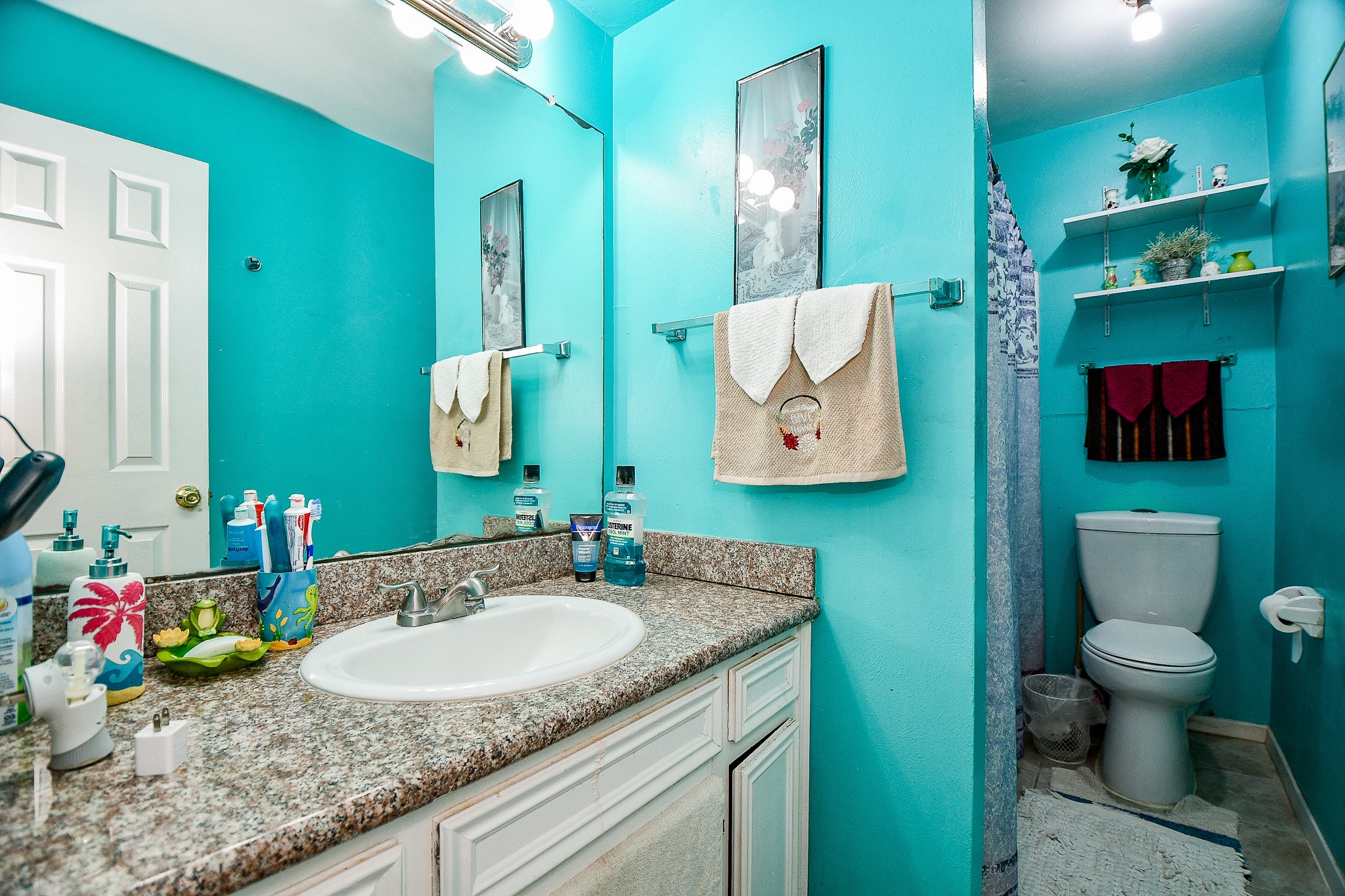 2923 West Greens Road Houston, TX 77067 - Photo 23 of 32 a bathroom with a granite countertop sink and a mirror