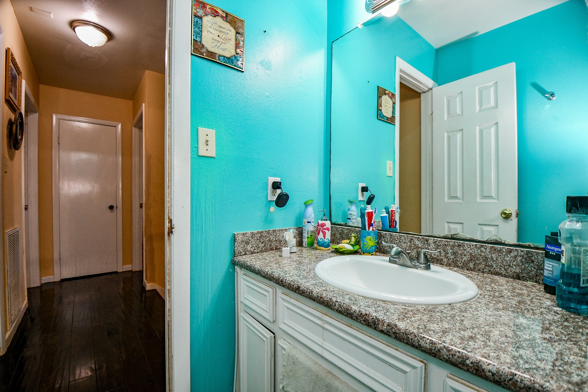 2923 West Greens Road Houston, TX 77067 - Photo 24 of 32 a bathroom with a granite countertop sink and a mirror