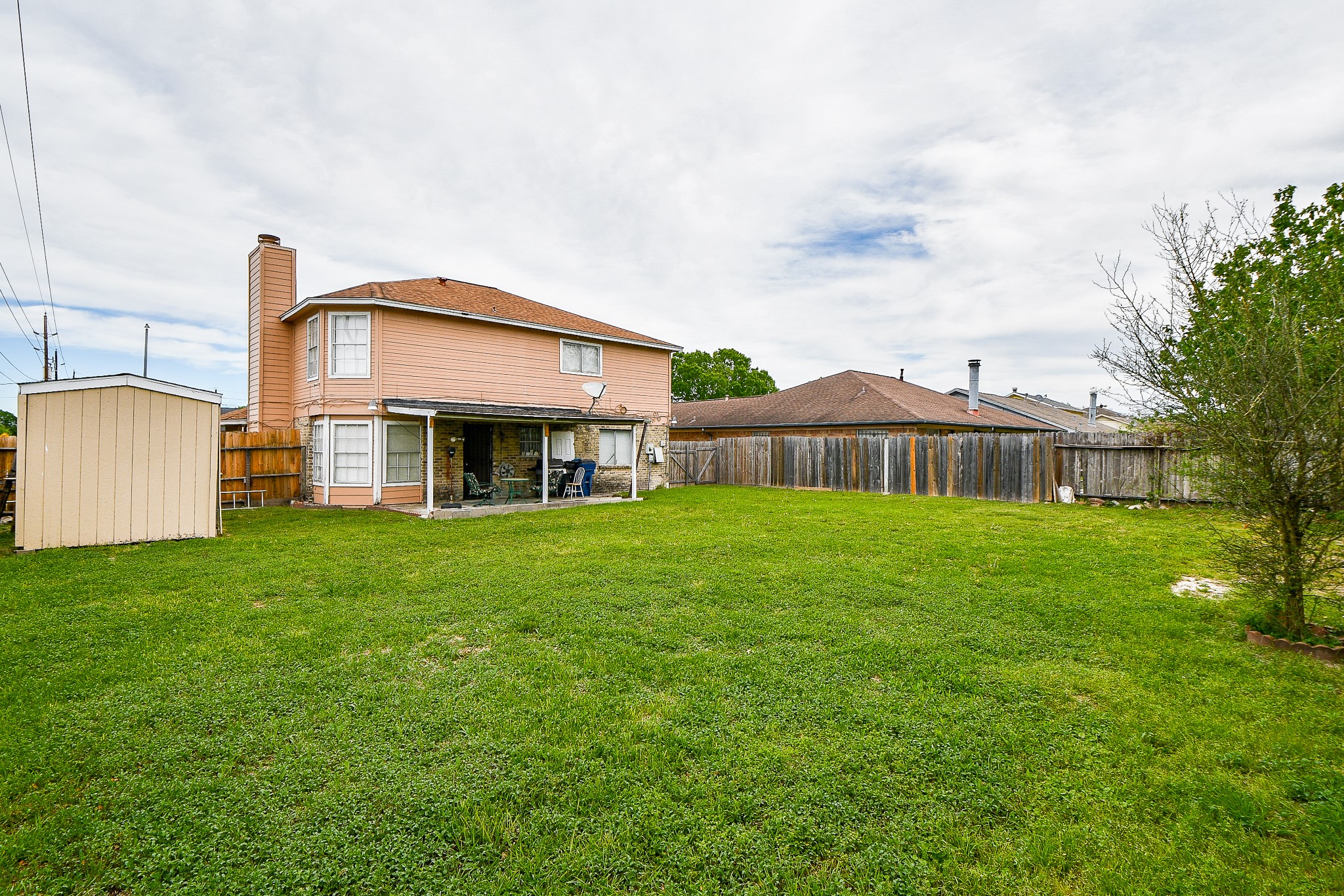2923 West Greens Road Houston, TX 77067 - Photo 32 of 32 a front view of house with yard and green space