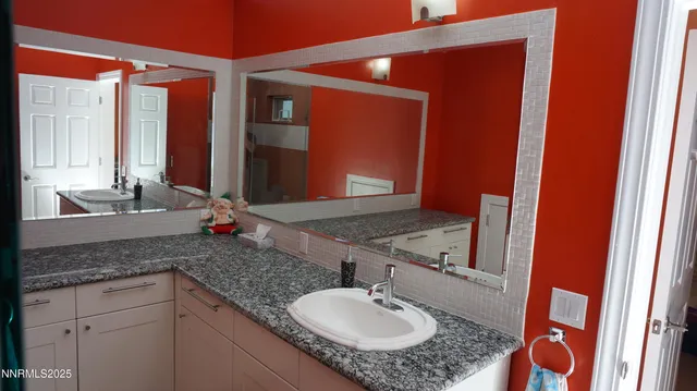 a view of a workspace with furniture and a workspace