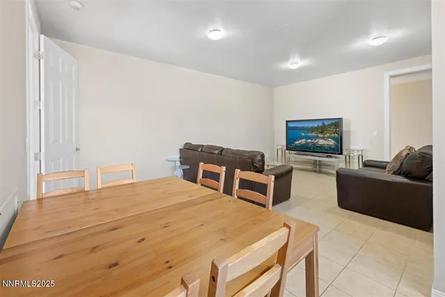 a view of a kitchen with a sink and wooden floor