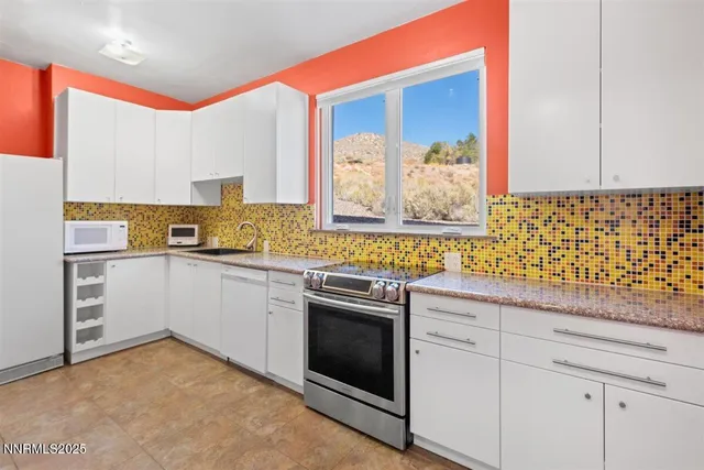 a spacious bedroom with a bed and large window