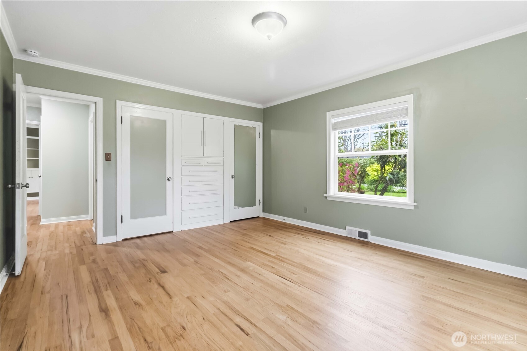 1306 23rd Avenue Longview, WA 98632 - Photo 13 of 40 a view of an empty room with wooden floor and a window