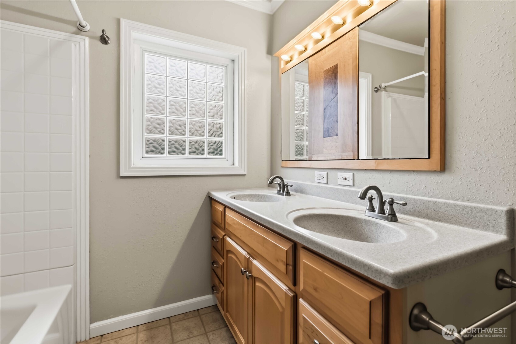 1306 23rd Avenue Longview, WA 98632 - Photo 15 of 40 a bathroom with a sink and a mirror