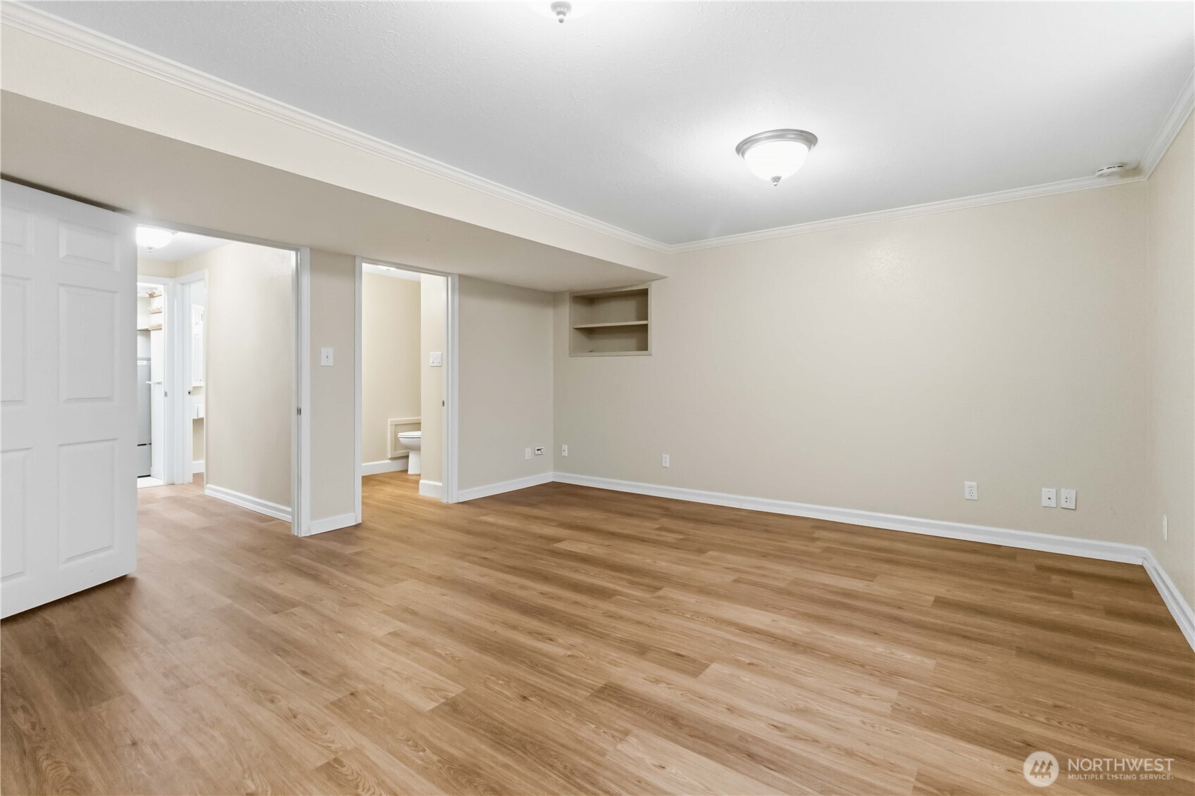 1306 23rd Avenue Longview, WA 98632 - Photo 18 of 40 a view of an empty room with wooden floor