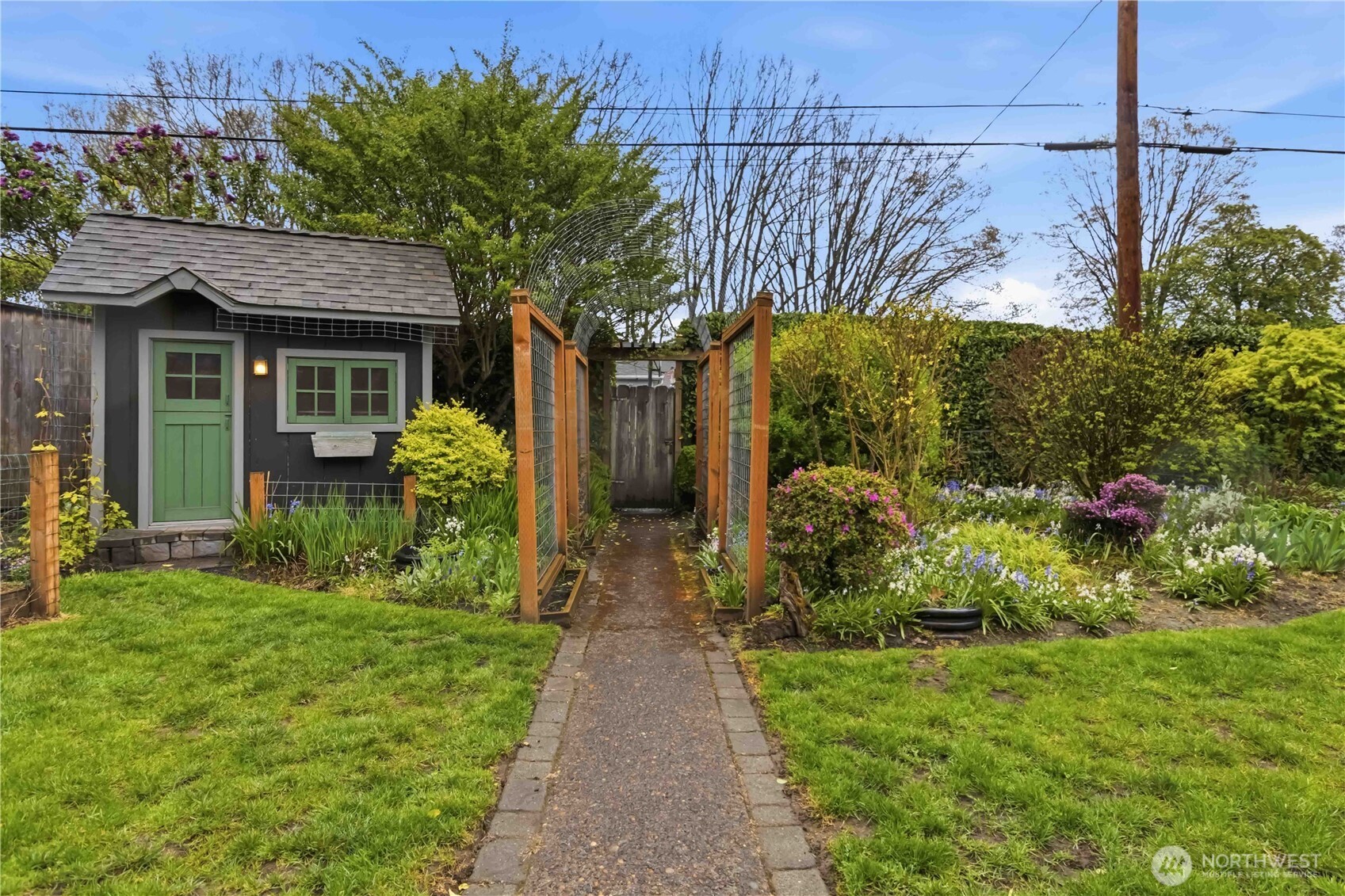 1306 23rd Avenue Longview, WA 98632 - Photo 31 of 40 a view of a house with a small yard and plants