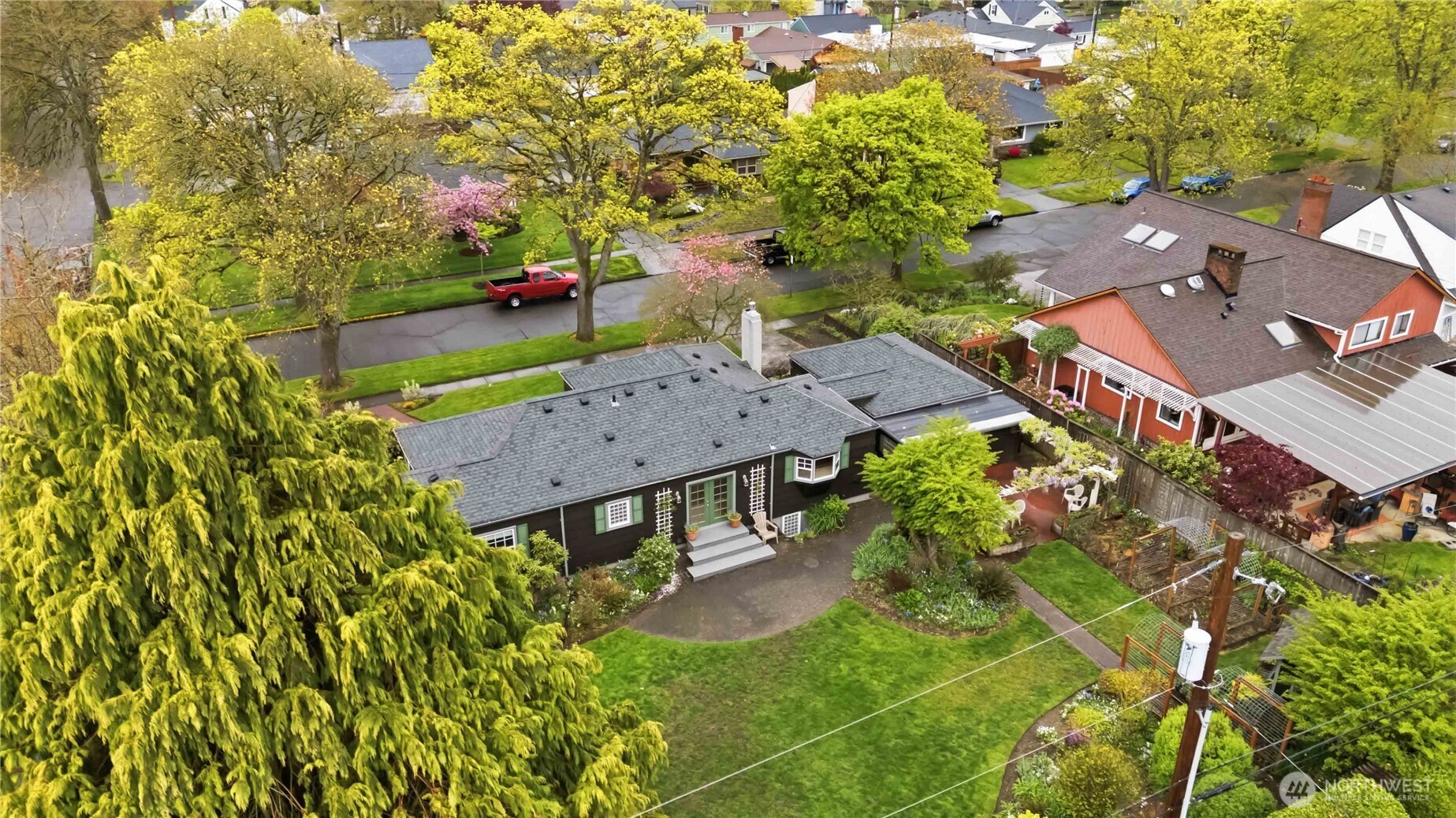 1306 23rd Avenue Longview, WA 98632 - Photo 4 of 40 an aerial view of a house with swimming pool a yard and a patio