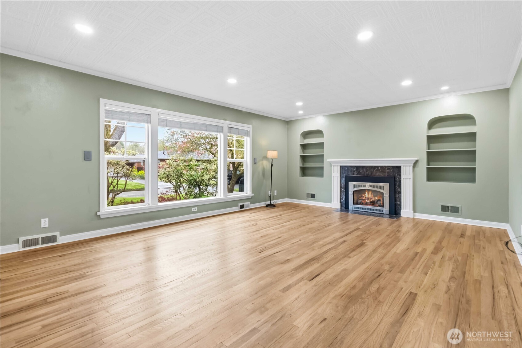 1306 23rd Avenue Longview, WA 98632 - Photo 5 of 40 an empty room with wooden floor and windows