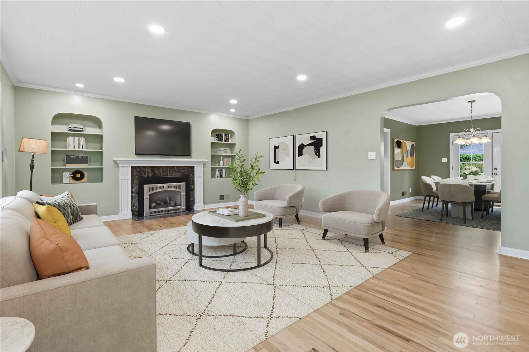 1306 23rd Avenue Longview, WA 98632 - Photo 6 of 40 a living room with furniture a fireplace and a flat screen tv
