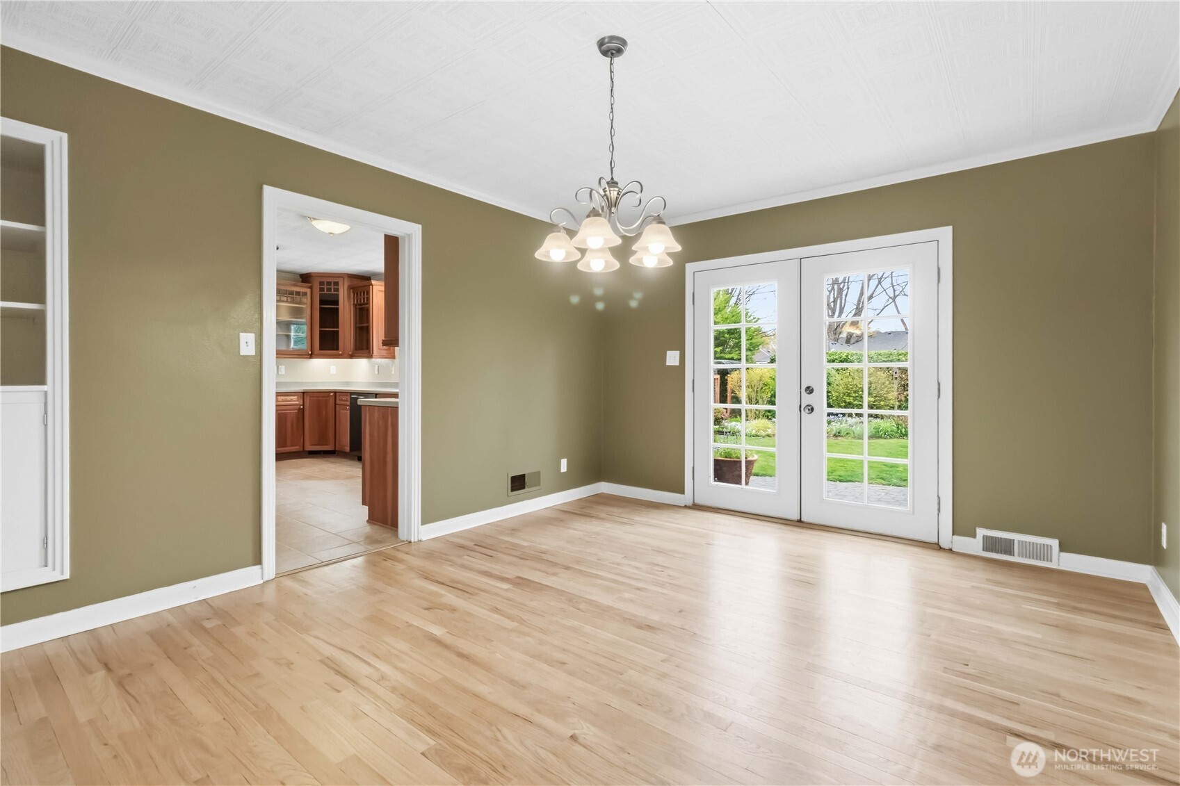 1306 23rd Avenue Longview, WA 98632 - Photo 8 of 40 a view of an empty room with window and wooden floor