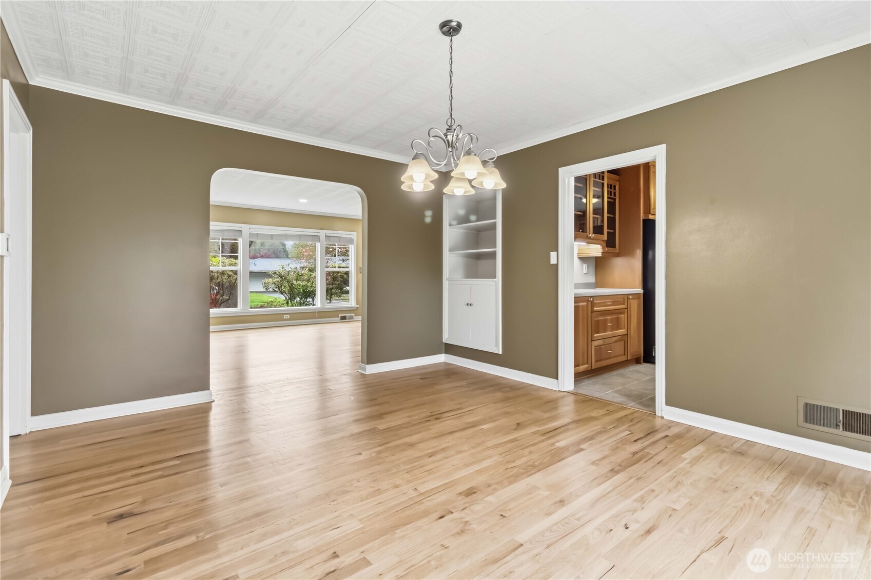 1306 23rd Avenue Longview, WA 98632 - Photo 9 of 40 a view of an empty room with wooden floor and a window