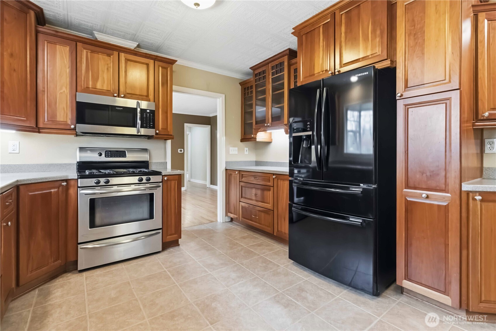 1306 23rd Avenue Longview, WA 98632 - Photo 10 of 40 a kitchen with a refrigerator stove and microwave