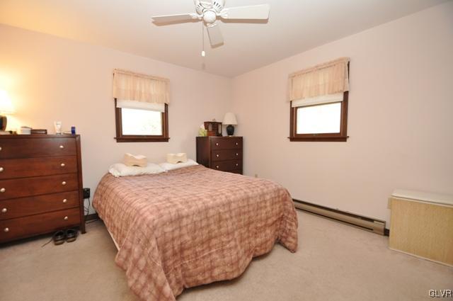 369 Timber Hill Road Henryville, PA 18332 - Photo 11 of 21 a bedroom with a bed and a dresser