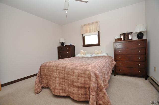 369 Timber Hill Road Henryville, PA 18332 - Photo 12 of 21 a bedroom with a bed and a window