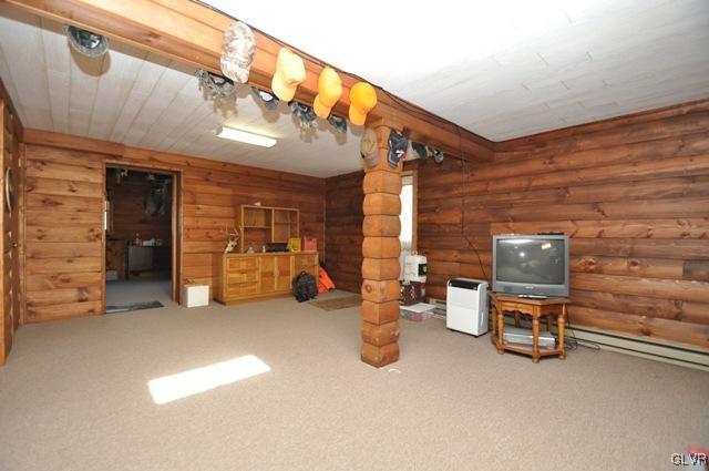 369 Timber Hill Road Henryville, PA 18332 - Photo 14 of 21 a view of a livingroom with furniture and a staircase
