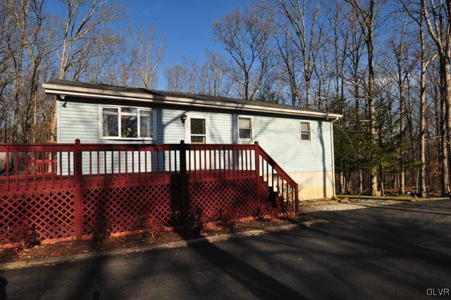369 Timber Hill Road Henryville, PA 18332 - Photo 2 of 21 a view of a house with a deck
