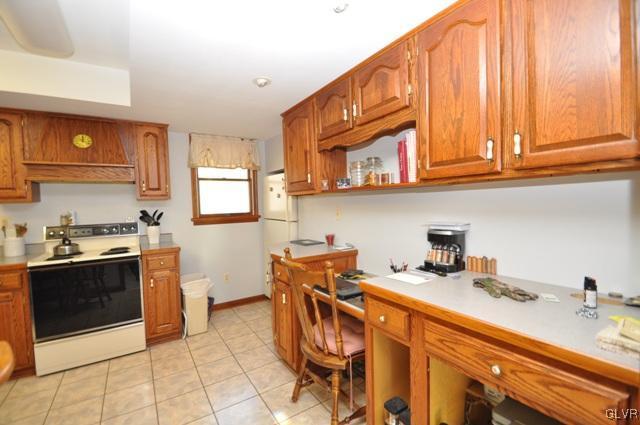 369 Timber Hill Road Henryville, PA 18332 - Photo 8 of 21 a utility room with stainless steel appliances granite countertop a stove and a sink