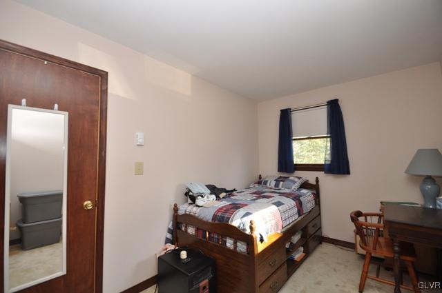369 Timber Hill Road Henryville, PA 18332 - Photo 10 of 21 a bedroom with bed and a window