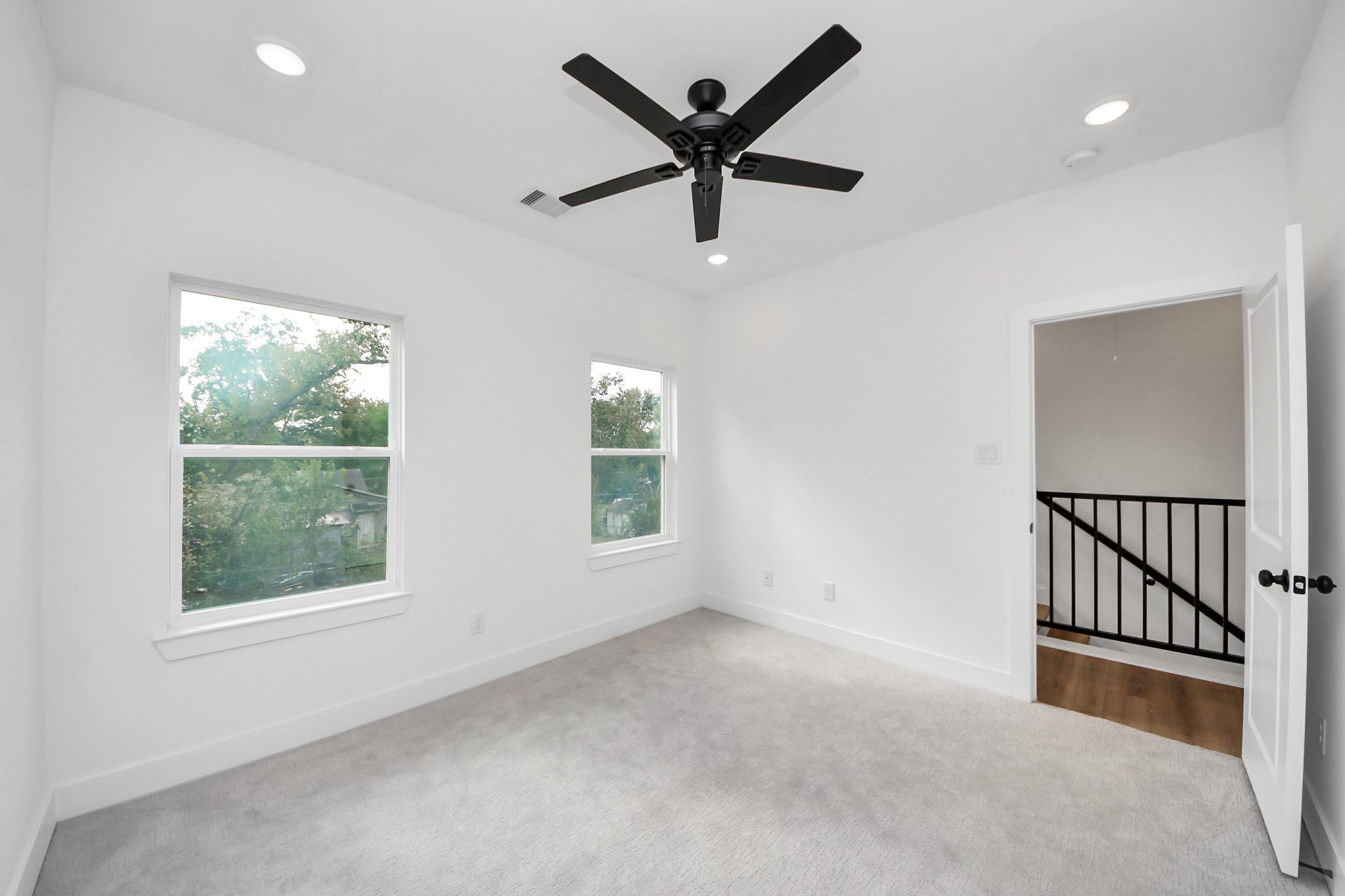 2708 Bostic Street, Unit B Houston, TX 77093 - Photo 11 of 26 an empty room with ceiling fan and windows