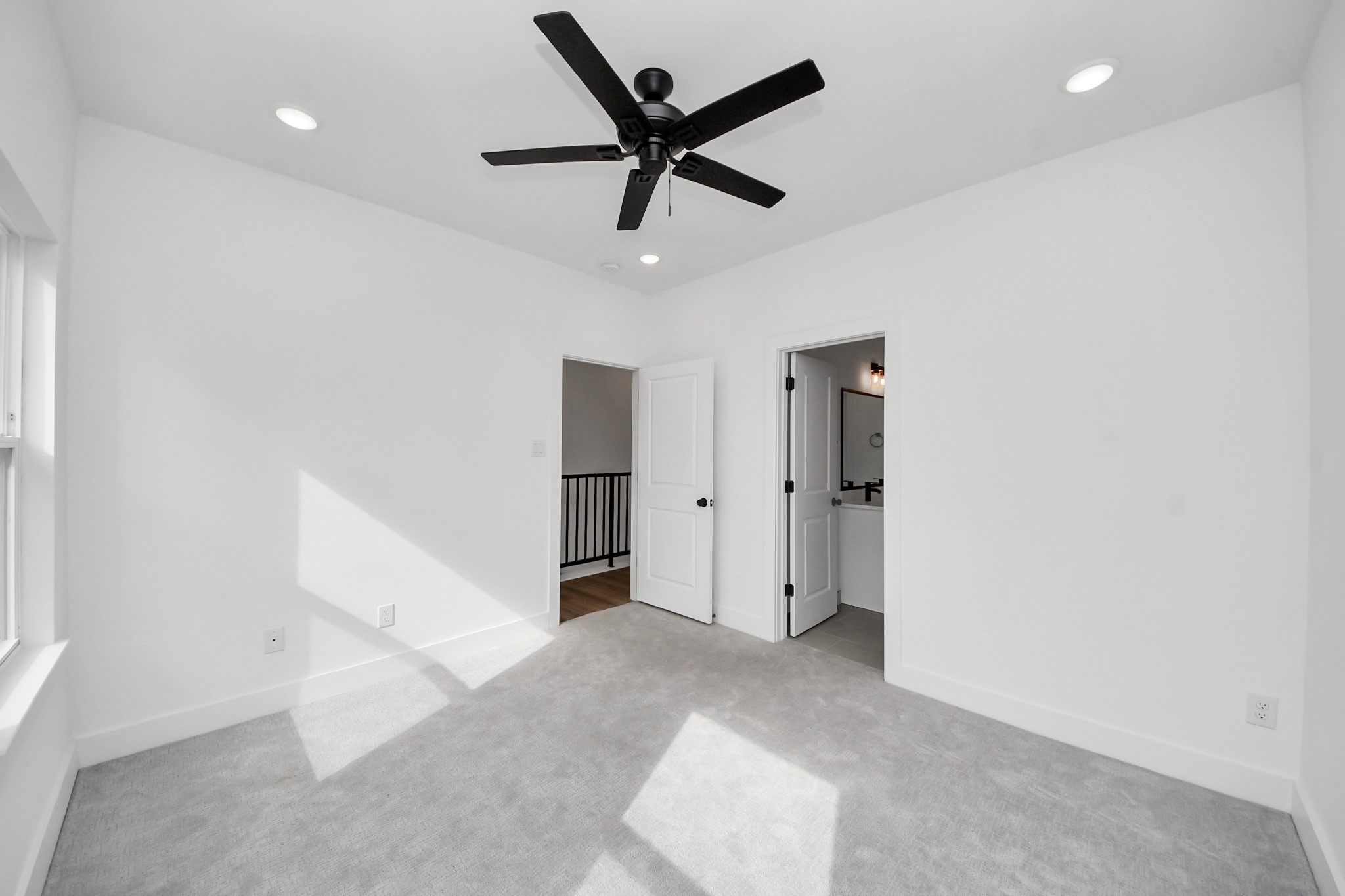 2708 Bostic Street, Unit B Houston, TX 77093 - Photo 12 of 26 an empty room with ceiling fan and window