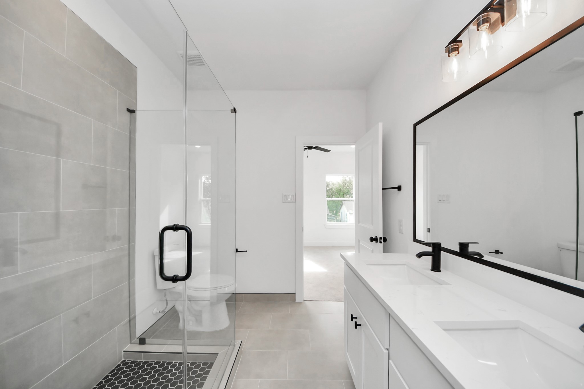 2708 Bostic Street, Unit B Houston, TX 77093 - Photo 15 of 26 a bathroom with a sink a mirror and a shower