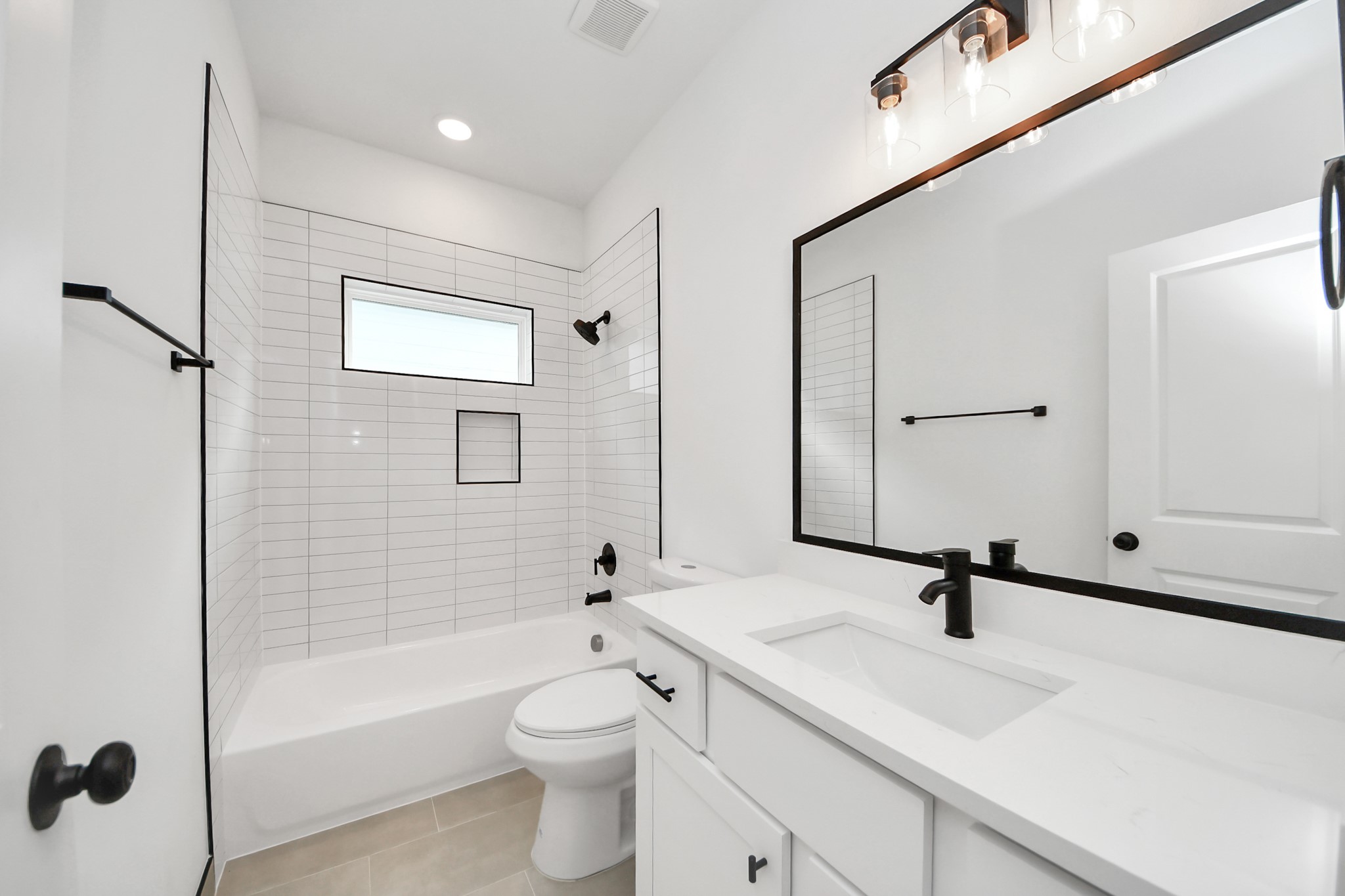 2708 Bostic Street, Unit B Houston, TX 77093 - Photo 20 of 26 a bathroom with a bathtub shower sink mirror and toilet