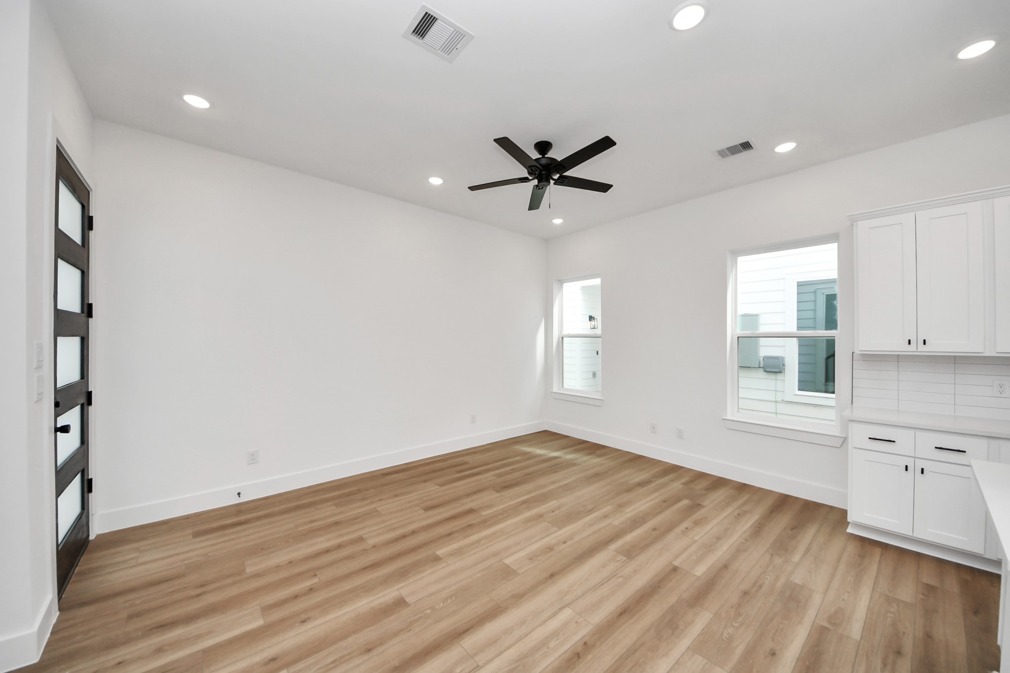 2708 Bostic Street, Unit B Houston, TX 77093 - Photo 4 of 26 wooden floor in an empty room with a window