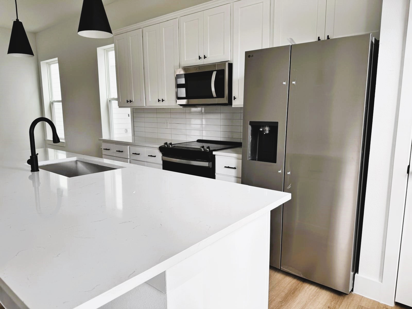 2708 Bostic Street, Unit B Houston, TX 77093 - Photo 5 of 26 a kitchen with stainless steel appliances a refrigerator and a stove top oven