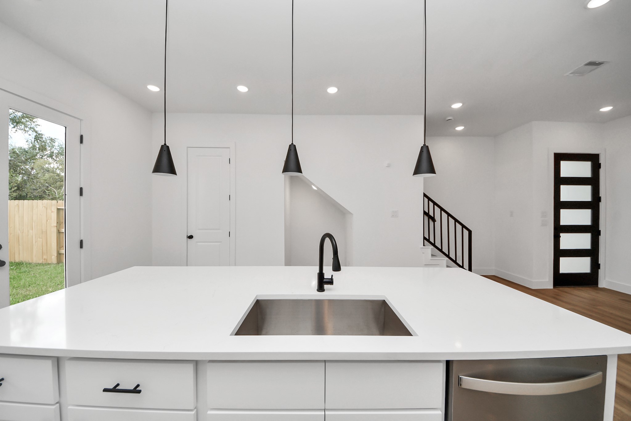 2708 Bostic Street, Unit B Houston, TX 77093 - Photo 6 of 26 a kitchen with a sink a window and wooden floor