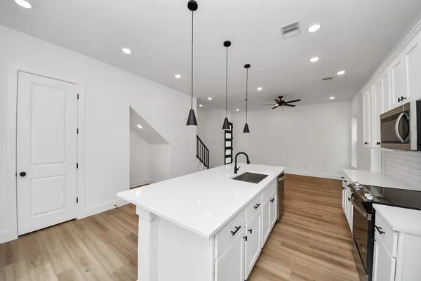 a bathroom with a sink and mirror