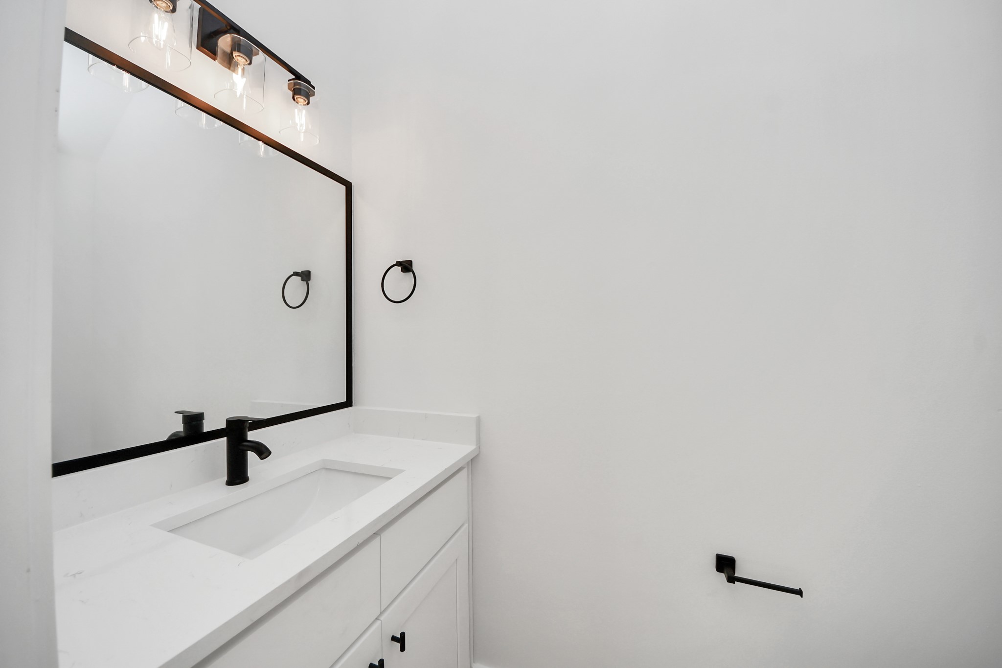 2708 Bostic Street, Unit B Houston, TX 77093 - Photo 8 of 26 a bathroom with a sink and mirror