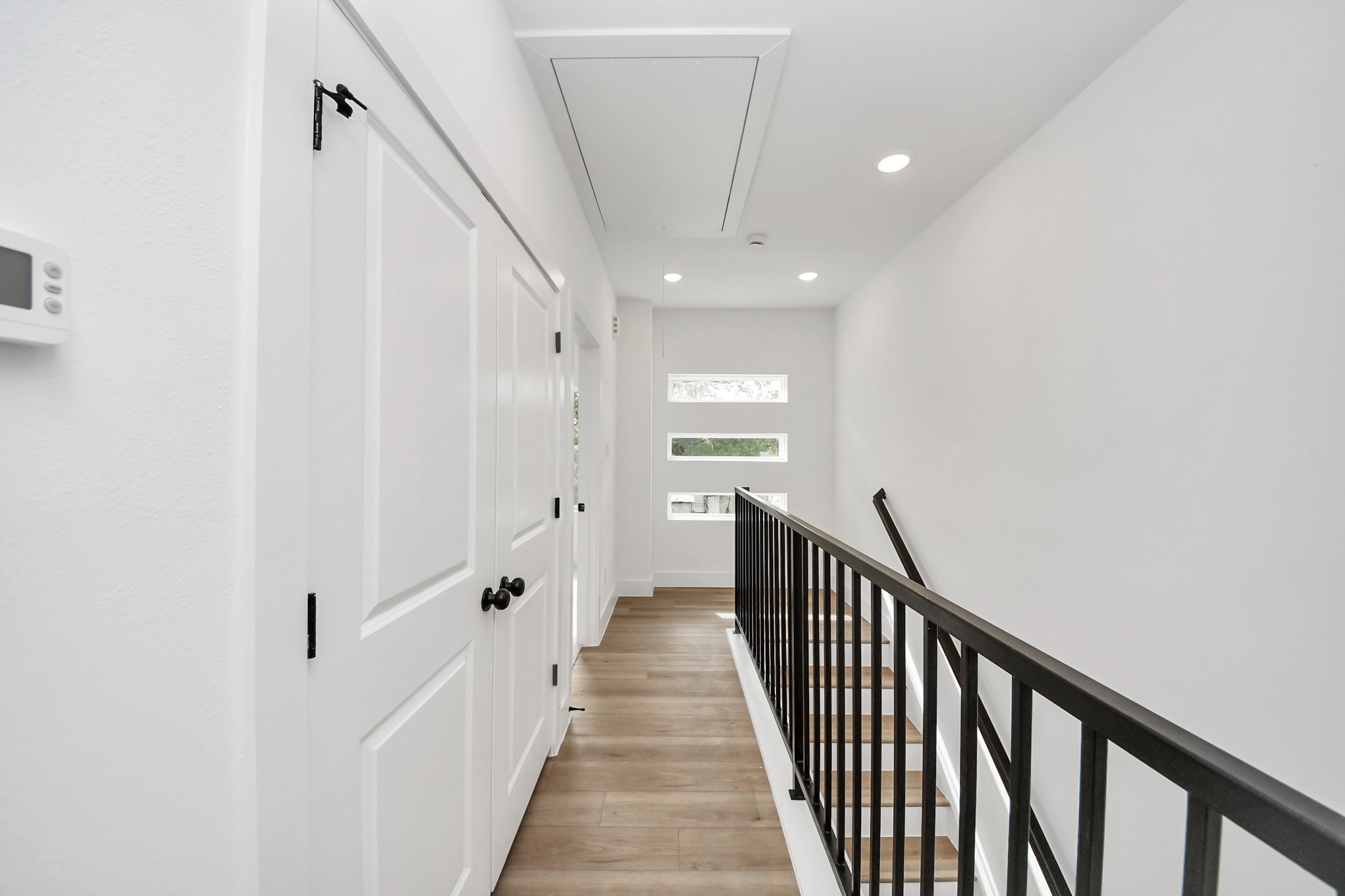 2708 Bostic Street, Unit B Houston, TX 77093 - Photo 10 of 26 a view of a hallway with wooden floor and entryway