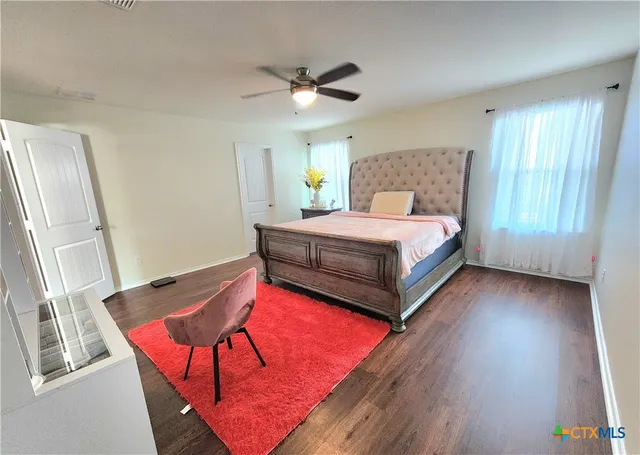 a bedroom with a bed and window