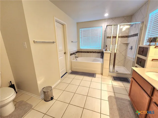 a bathroom with a bathtub and a sink