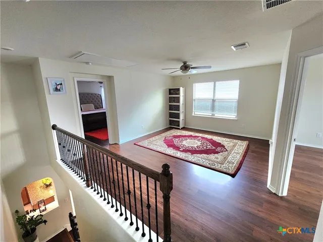 a view of staircase with lots of windows